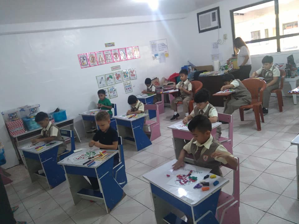 College of Subic Montessori students working on a classroom activity